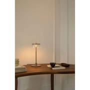 Nuura LED-bordlampe Blossi, højde 31 cm, guldfarvet/klar