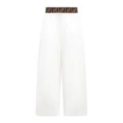 Hvide bukser med bredt ben og brun logo talje