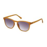 Elegante runde solbriller med røgfarvede gradientlinser