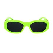Solbriller med uregelmæssig form i fluorescerende grøn og mørkegrå