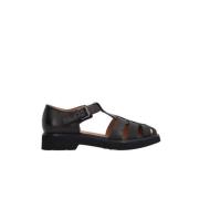 Sorte flade sandaler i læder med justerbar ankelrem