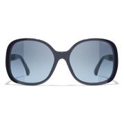 Ikoniske solbriller med blå linser