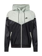 Nike Sportswear Overgangsjakke 'Heritage Essentials'  pastelgrøn / sor...