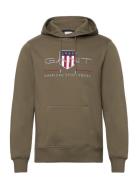 Reg Archive Shield Hoodie Tops Sweatshirts & Hoodies Hoodies Green GAN...